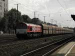 HGK Class 66 DE 671 mit einem DB Kohlezug in K�ln West am 2.9.2011